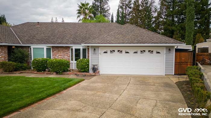 Updated home exterior in Roseville featuring James Hardie Cedarmill siding, Milgard windows, and a landscaped front yard