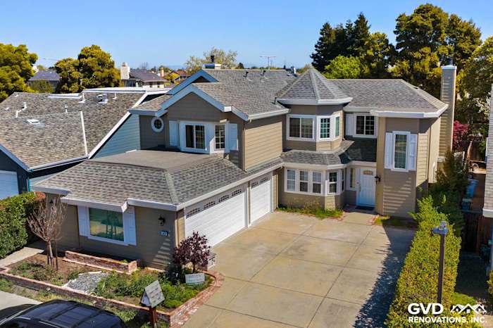 Monterey Taupe James Hardie lap siding and Arctic White trim on a redesigned Foster City home exterior