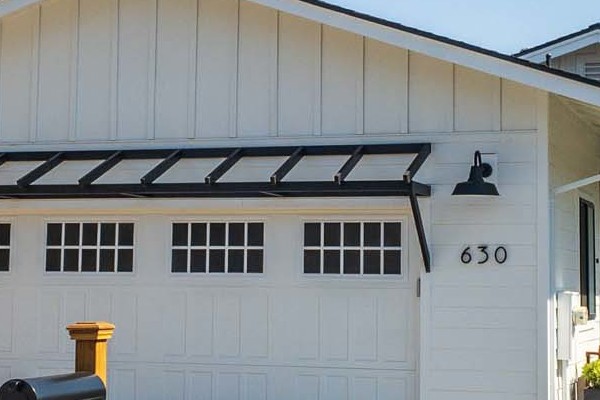 Updated home exterior in Novato, featuring James Hardie Board and Batten Siding with a modern white finish
