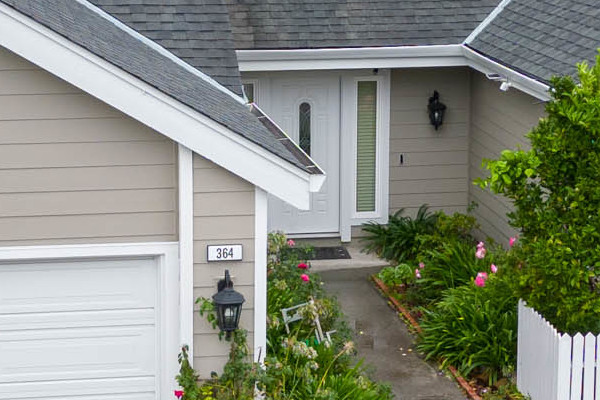 Renovated home exterior featuring James Hardie siding in Monterey Taupe and Milgard windows in Foster City, CA