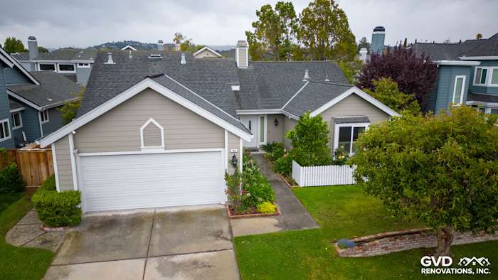 Renovated home exterior featuring James Hardie siding in Monterey Taupe and Milgard windows in Foster City, CA