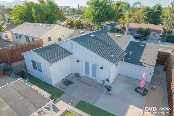 Modern home exterior featuring Arctic White James Hardie vertical siding and dark roof in Concord, CA