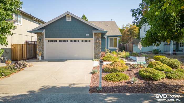 Evening Blue James Hardie Lap Siding with Cobble Stone Trim on Petaluma home exterior, landscaped front yard