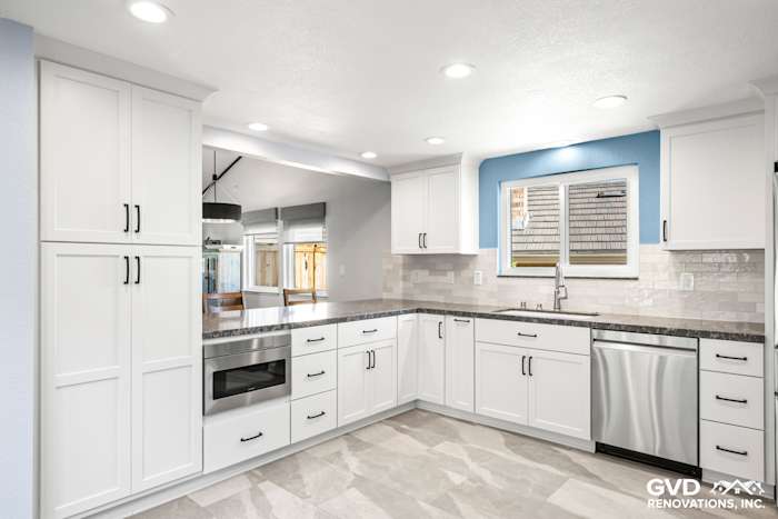 Modern Fair Oaks kitchen remodel featuring white cabinets, quartz countertops, and stainless steel appliances