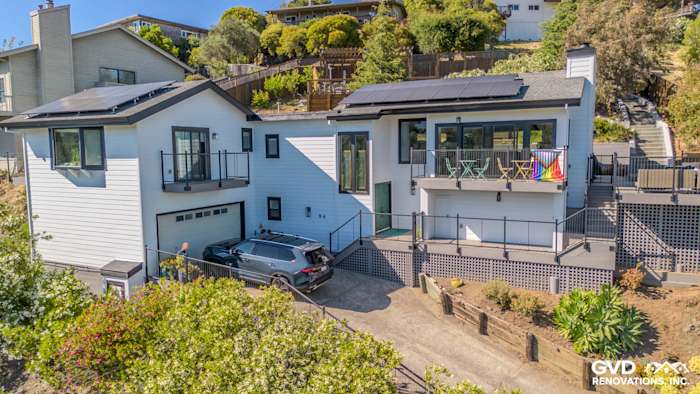 Modern home exterior in San Rafael, featuring James Hardie Arctic White siding, Anlin Catalina windows, and a new balcony