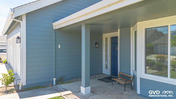 Boothbay Blue James Hardie siding with Arctic White trim on Foster City home entrance and porch