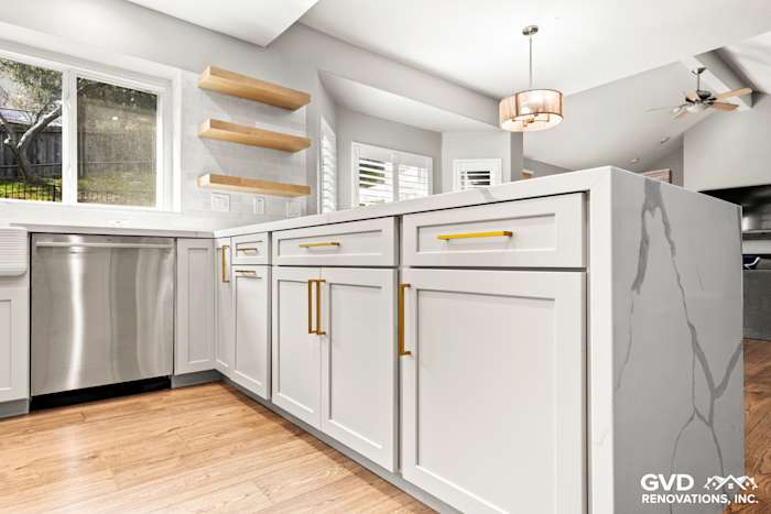 Modern kitchen remodel in El Dorado Hills featuring gray custom cabinets and luxurious quartz countertops