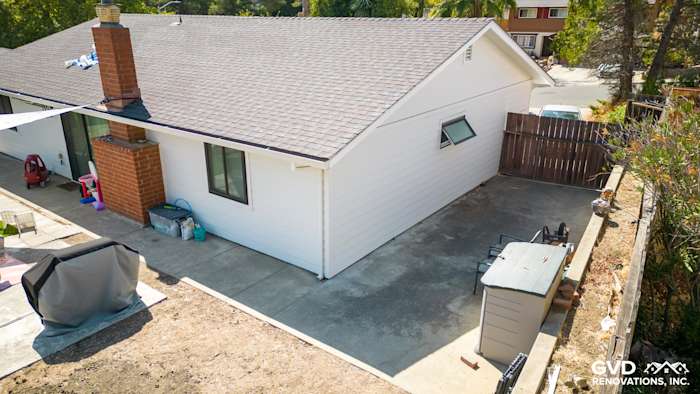Rear view of a home in Pinole with Arctic White James Hardie siding and a newly landscaped patio area