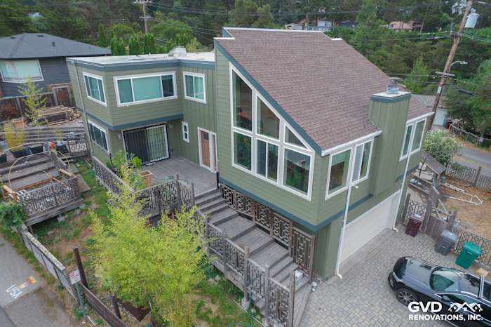 Oakland home with Mountain Sage vertical siding, CobbleStone trim, and Anlin Catalina windows from an aerial view