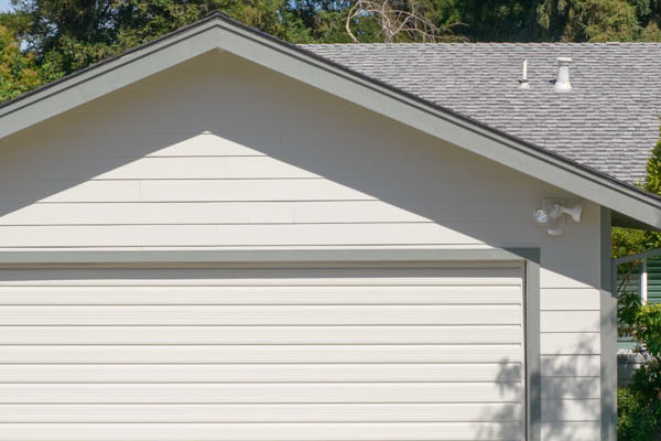 Home exterior featuring newly installed James Hardie siding, Anlin Catalina windows, and a well-maintained front yard