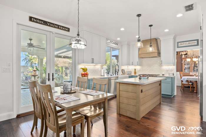 Bright kitchen remodel in Roseville featuring Fieldstone cabinetry, MSI quartzite countertops, and a spacious dining area