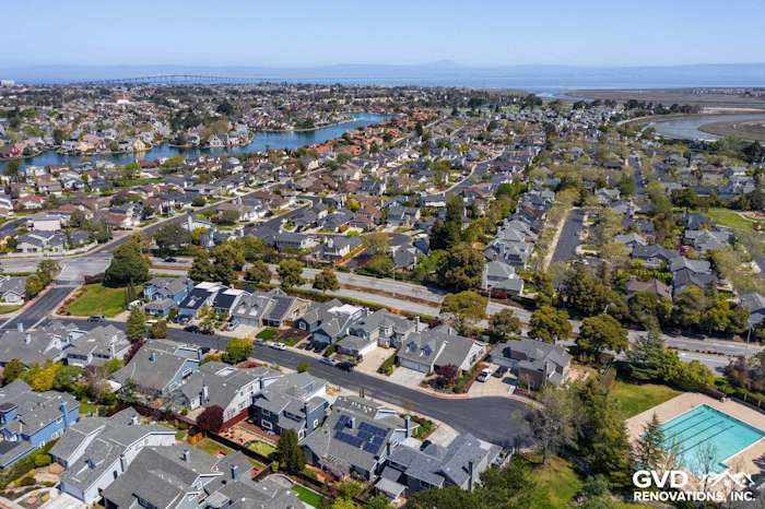 Aerial view of Foster City homes featuring James Hardie siding and Mezzo windows with scenic bay backdrop
