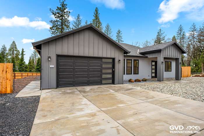 Modern home exterior in Paradise, CA with James Hardie Architectural Panels and Milgard Windows in black