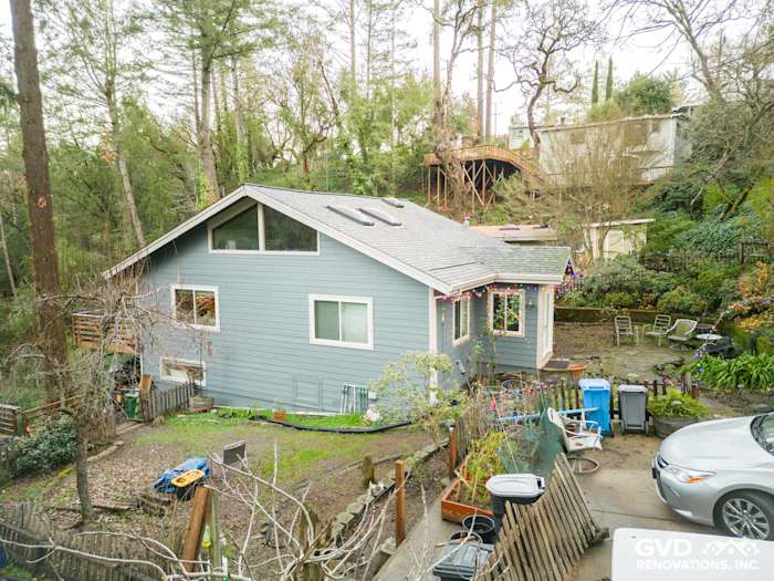 Modern home exterior featuring Boothbay Blue James Hardie siding with white trim in Forestville, CA