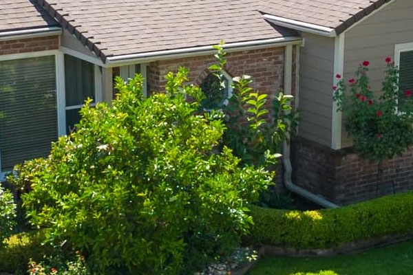 Sleek exterior of a home in Sacramento with Khaki Brown James Hardie siding and well-maintained lawn
