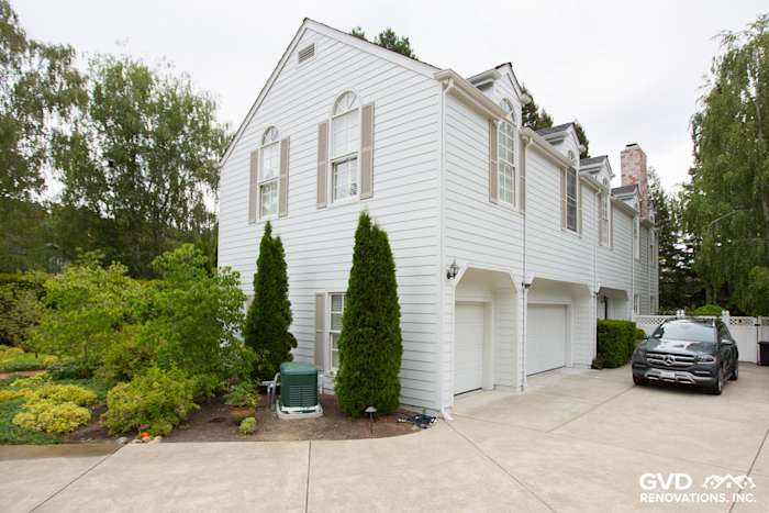 New Arctic White James Hardie Lap Siding and trim on a home exterior in Orinda, CA with landscaped yard