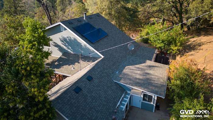 Gray Slate James Hardie lap siding and Arctic White trim on a renovated Colfax home exterior with a sloped roof