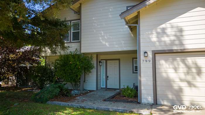 Two-story home exterior featuring James Hardie lap siding and trim, with a landscaped front entryway