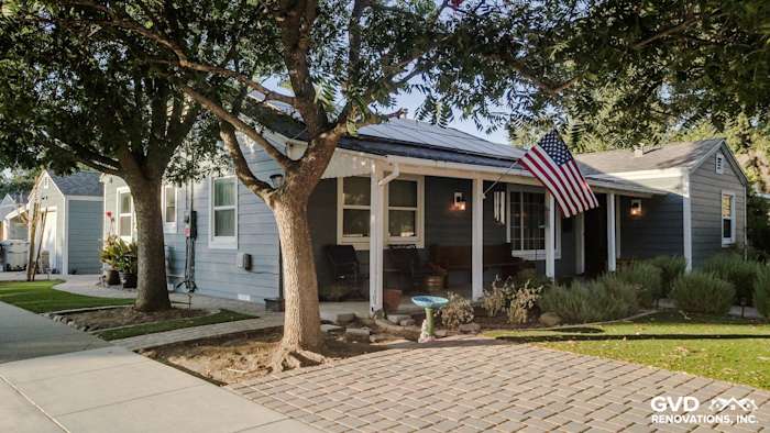 Charming Winters, CA home featuring Boothbay Blue HardiePlank siding and Arctic White trim with American flag accent