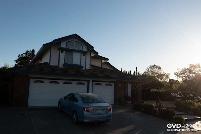 Charming home exterior featuring Arctic White HardiePlank siding and a blue car in Hercules, CA