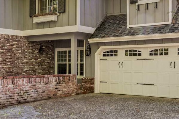 Granite Bay home with James Hardie board and batten siding, Anlin windows, and stone accents. Modern curb appeal