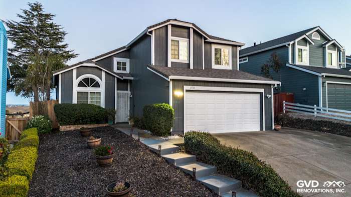 Home exterior in Vallejo featuring James Hardie Evening Blue siding, Arctic White trim, and modern landscaping