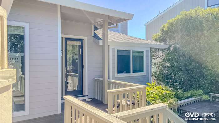 Modern home exterior featuring James Hardie Pearl Gray siding, Arctic White trim, and Milgard windows in Mill Valley