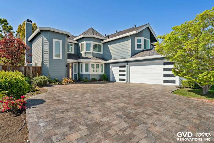 Boothbay Blue HardiePlank siding and Arctic White trim on a remodeled Foster City home with paver driveway