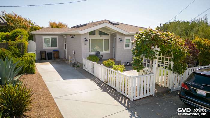 Mill Valley home featuring new Pearl Gray James Hardie shingle siding and Arctic White trim, landscaped front yard