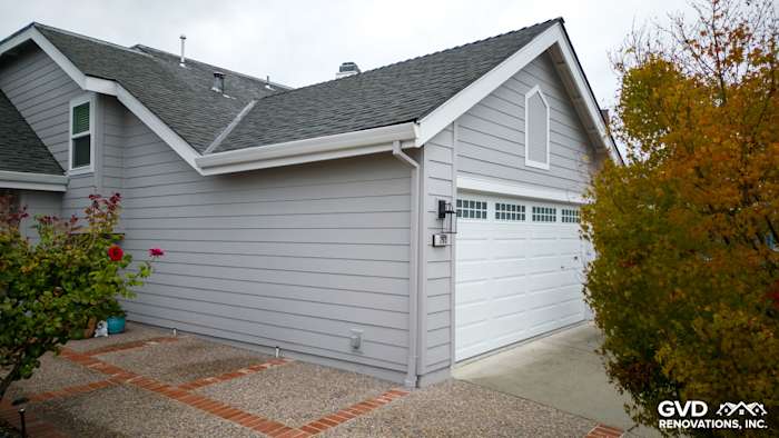 New Pearl Gray James Hardie siding and Milgard windows on home exterior in Foster City