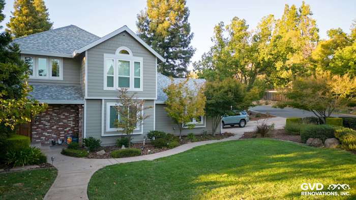 Fair Oaks home featuring James Hardie Cedarmill Siding in Monterey Taupe and Arctic White trim, surrounded by landscaped yard