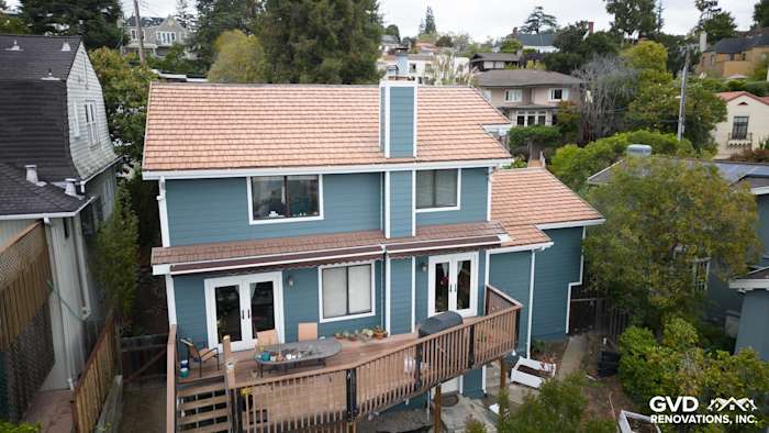 Oakland home featuring James Hardie Evening Blue Cedarmill lap siding and Rustic Grain Arctic White trim, with a deck