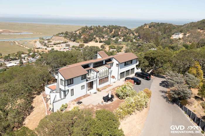 Aerial view of a San Rafael home with Arctic White James Hardie siding and a brown roof