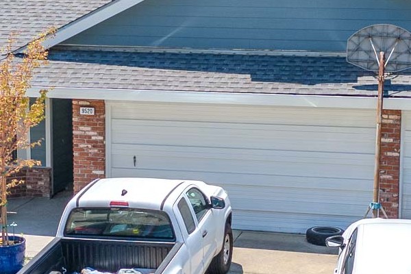 Home exterior in Elk Grove featuring James Hardie BoothBay Blue siding and white trim, enhancing curb appeal