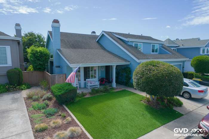 Transformed home exterior in Foster City featuring James Hardie siding, Alside windows, and manicured landscaping