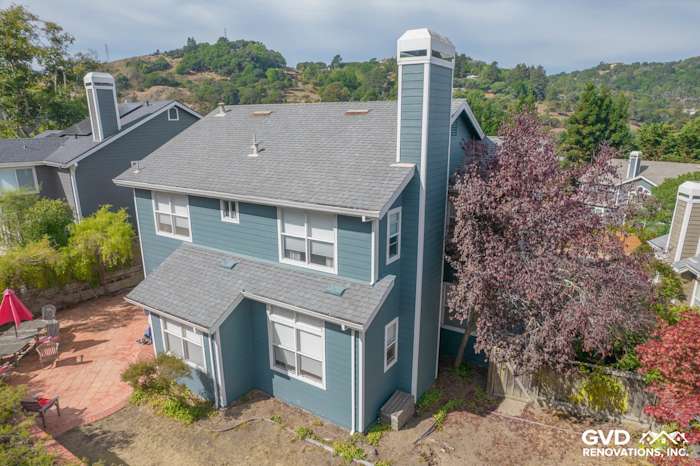 Two-story home exterior showcasing James Hardie Evening Blue siding and Arctic White trim in Corte Madera, CA