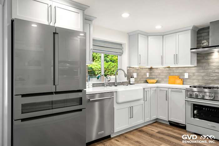 Modern kitchen remodel in Rocklin featuring gray cabinetry, stainless steel appliances, and a farmhouse sink