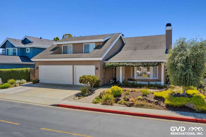 Foster City home with Khaki Brown HardiePlank siding, Arctic White trim, and landscaped front yard