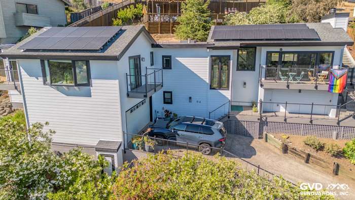 Modern home exterior in San Rafael featuring James Hardie Arctic White siding and Anlin Catalina windows with a new deck