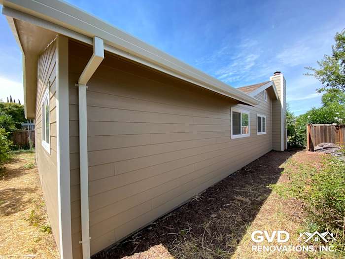 New Khaki Brown James Hardie lap siding with Arctic White trim on Fairfield home exterior
