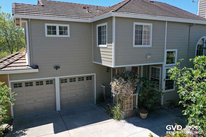 Updated home exterior featuring ColorPlus Monterey Taupe HardiePlank siding and Arctic White trim in Petaluma, CA