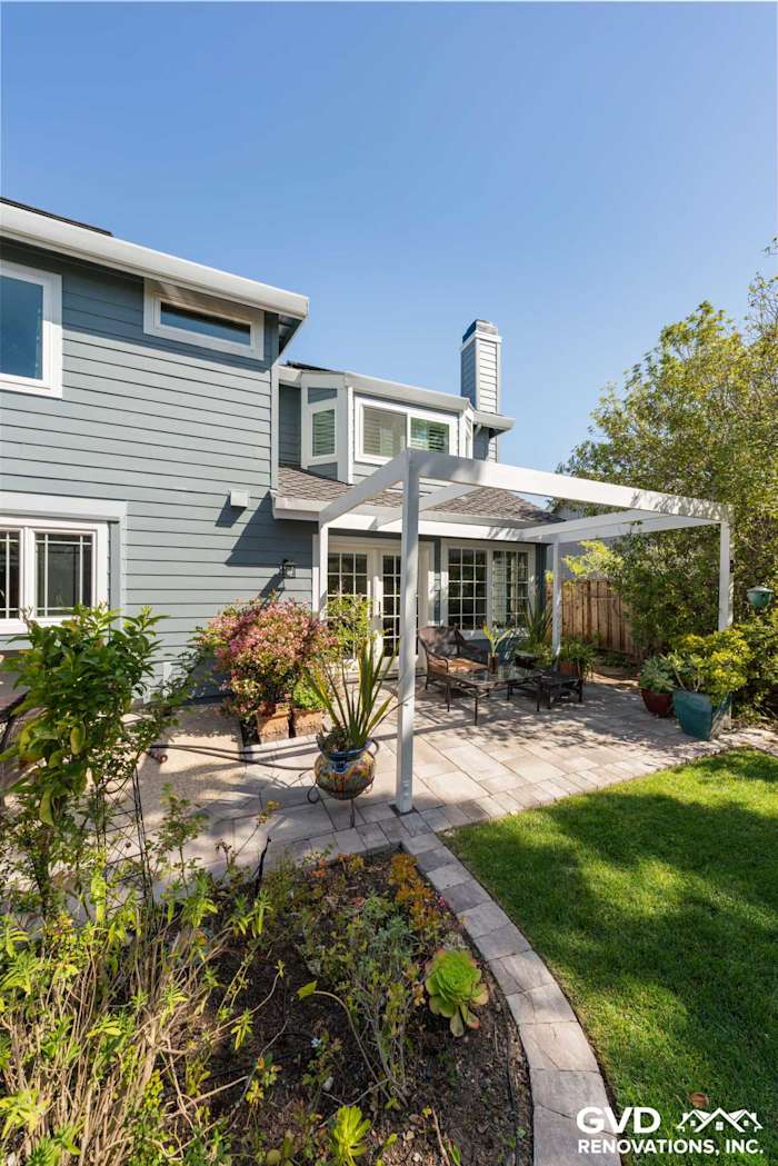 Boothbay Blue HardiePlank siding and Milgard windows with a shaded patio area in Foster City