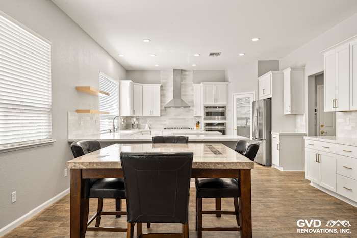 Modern kitchen with white Diamond cabinets, MSI countertops, full-height backsplash, and floating shelves in Roseville, CA