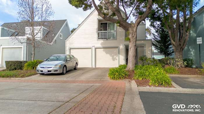 Updated home exterior showcasing James Hardie siding and Milgard windows in Fremont, CA with green landscaping