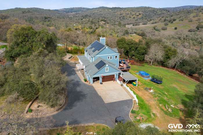 Two-story home in Shingle Springs with new blue James Hardie siding and a spacious driveway