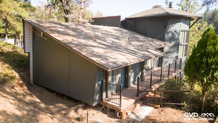 Iron Gray James Hardie Plank siding on a modern home exterior in Meadow Vista, featuring a sloped roof and deck
