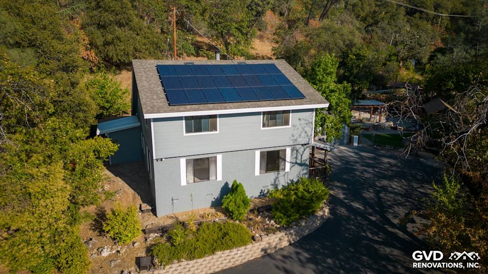 Gray Slate James Hardie lap siding with Arctic White trim on a Colfax home, featuring solar panels on the roof