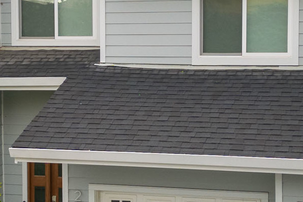 Light Mist James Hardie Lap Siding and Arctic White Trim on a modern Belmont home exterior