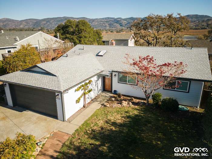 Modern Napa home featuring crisp Arctic White James Hardie siding and a new roof with mountain views