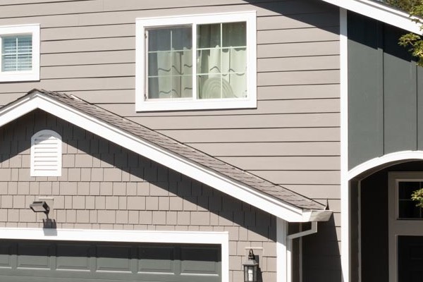 Exterior of a renovated home featuring James Hardie Aged Pewter siding and Arctic White trim in Rohnert Park